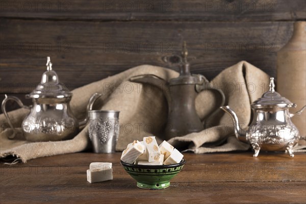 Turkish delight with teapots wooden table