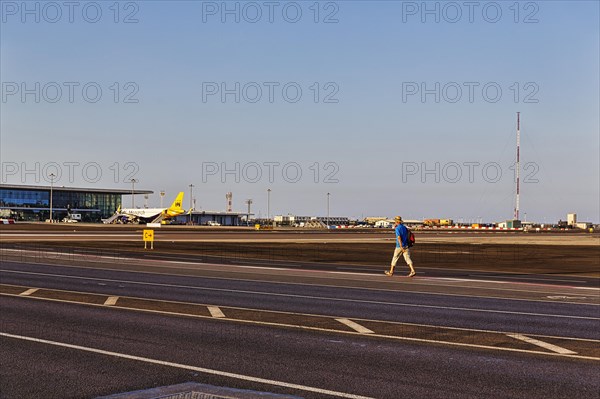 Tourist walking on Winston Churchill Avenue