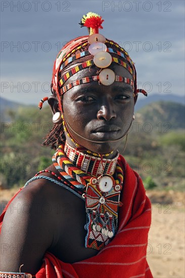 Portrait of Samburu warrior in traditional red dress