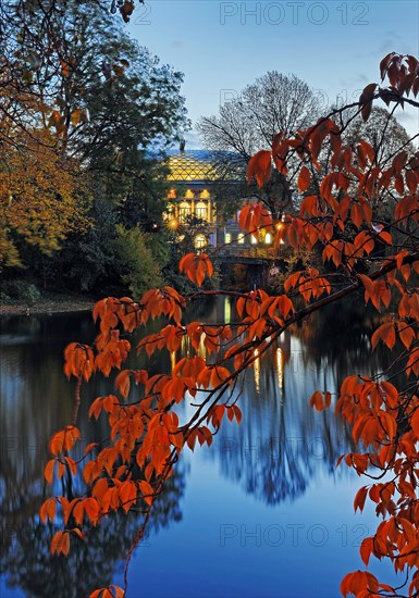 The Staendehaus K21 is reflected in the Kaiserteich in autumn in the evening