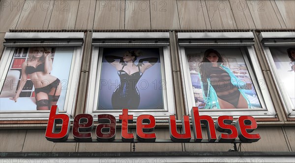 Logo Beate Uhse with advertising posters