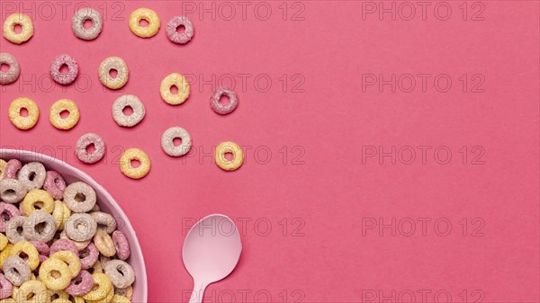 Bowl cereal fruit loops with spoon copy space