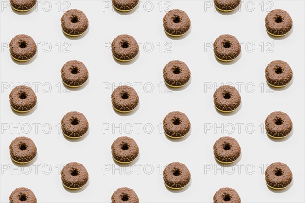 Bakery pattern with chocolate donuts