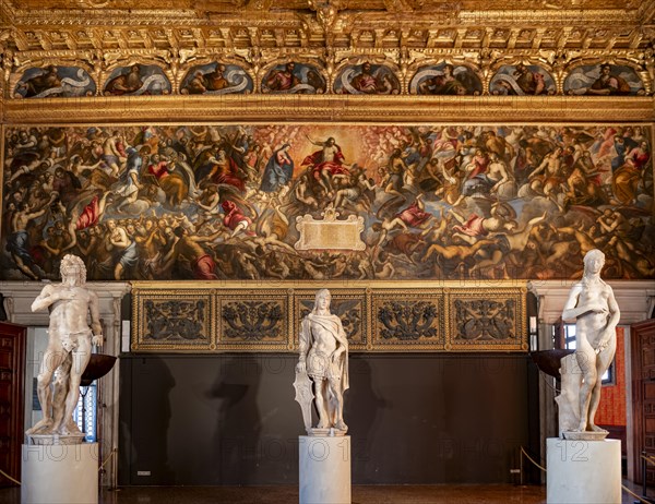 Sculptures in front of decorated wall