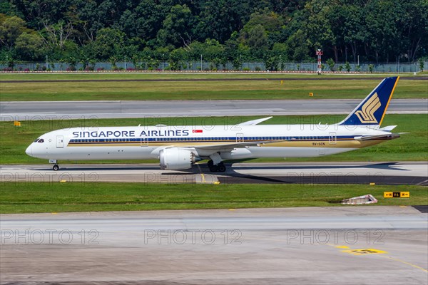 A Boeing 787-10 Dreamliner aircraft of Singapore Airlines with the registration 9V-SCN at Changi Airport
