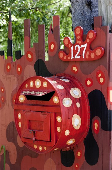 Modern Aboriginal art on a letterbox at the entrance to a house