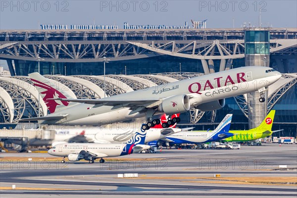 A Qatar Cargo Boeing 777-F aircraft with the registration number A7-BFK at Bangkok Suvarnabhumi Airport