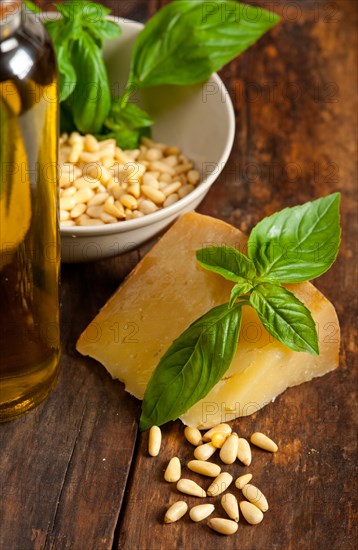 Italian basil pesto ingredients over old wood macro