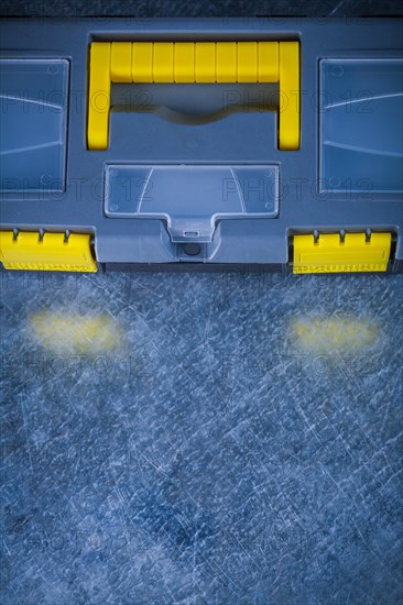 Copy space image of a closed tool set on a scratched metallic background Design concept