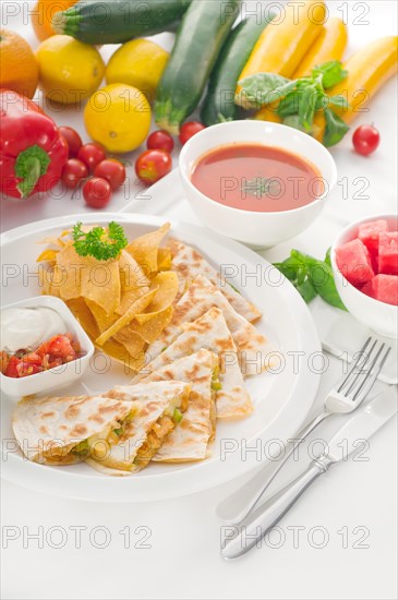 Original Mexican quesadilla de pollo with nachos served with gazpacho soup and watermelon