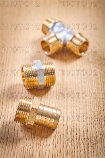 Three sanitary fittings on wooden panel