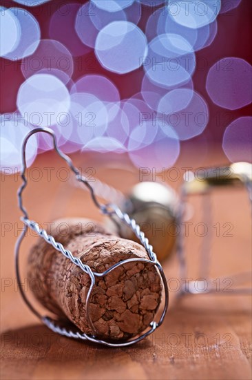 Champagne cork on wooden table close-up