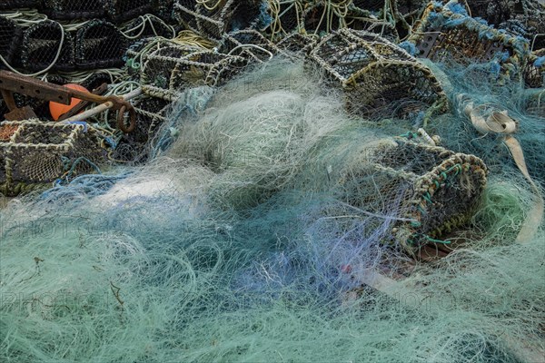 Turquoise fishing net and lobster baskets