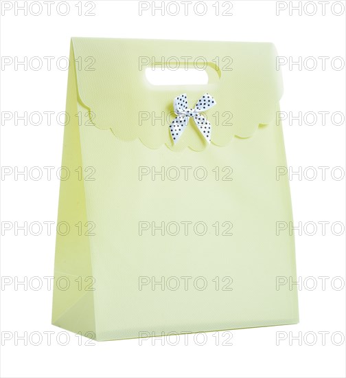 A paper bag with a bow