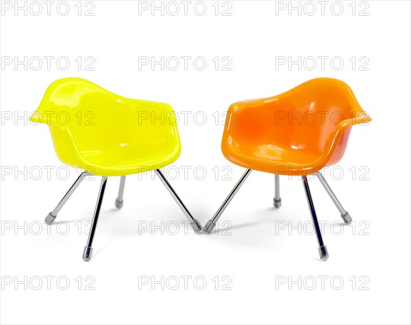 Coulored plastic chairs isolated on white background