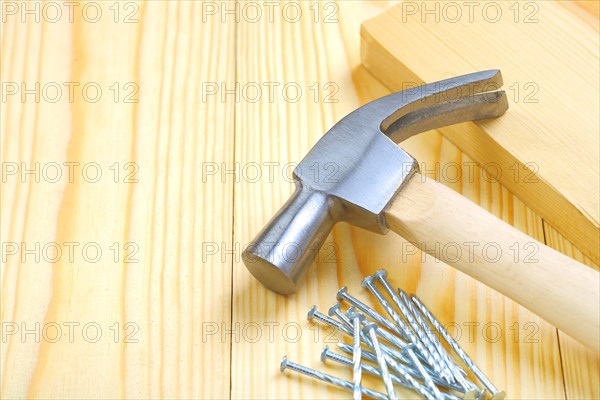 Hammer with nails and boards