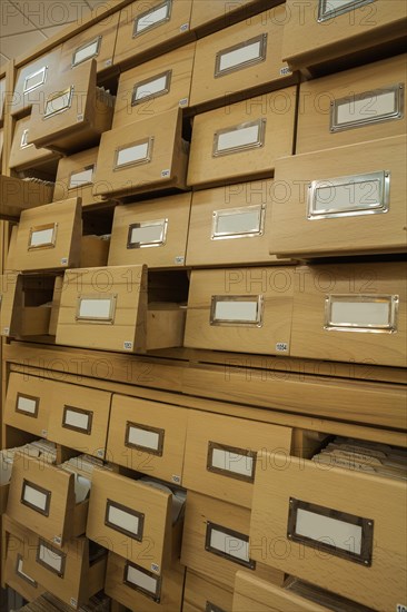 Library wooden card catalogue with opened crates