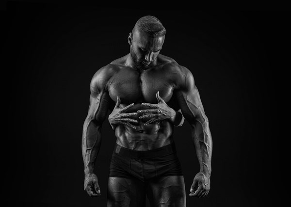 Perfect abdomen. Female hands embracing
