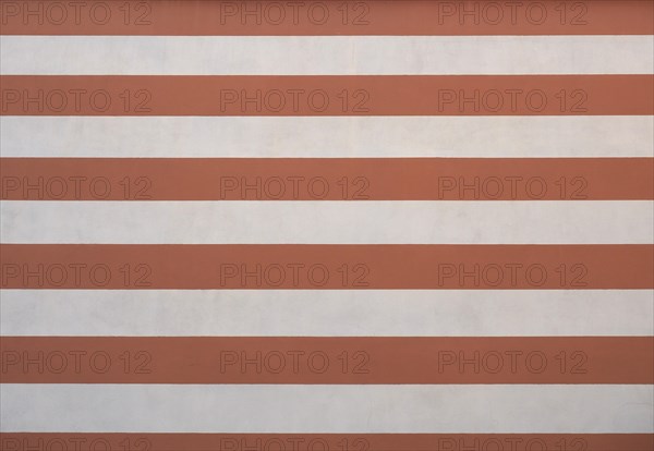 Striped brown and white plaster texture background
