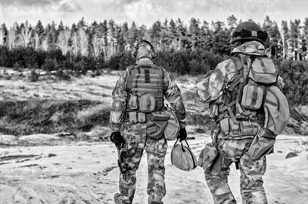 Two soldiers of a special unit are preparing to carry out a dangerous mission.