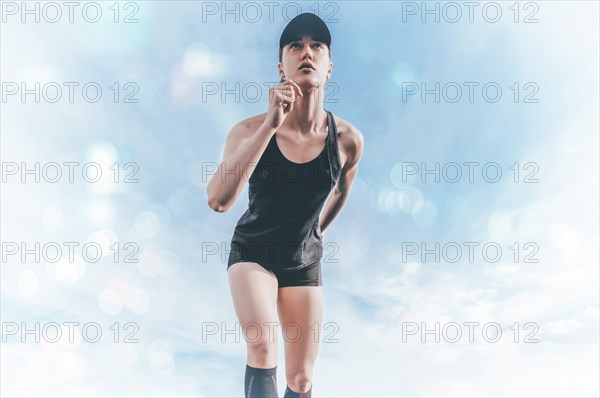 Professional runner stands on the track and prepares for the start of the race. Sports concept.