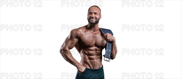 Athlete posing with an athletic belt on a white background. Fitness