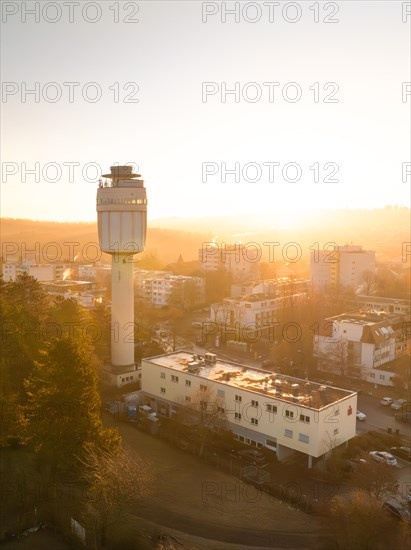 Sunrise behind a water tower