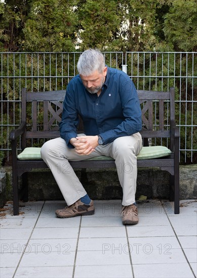 Man with grey hair and a full beard