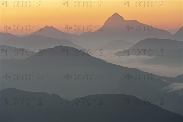 Morning atmosphere over mountain ranges, twilight, haze, fog, backlight, view from Jochberg to