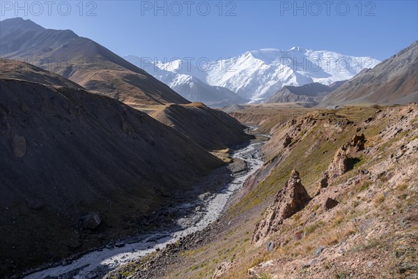 Valley with river Achik Tash between high mountains, mountain landscape with peak Pik Lenin, Osh