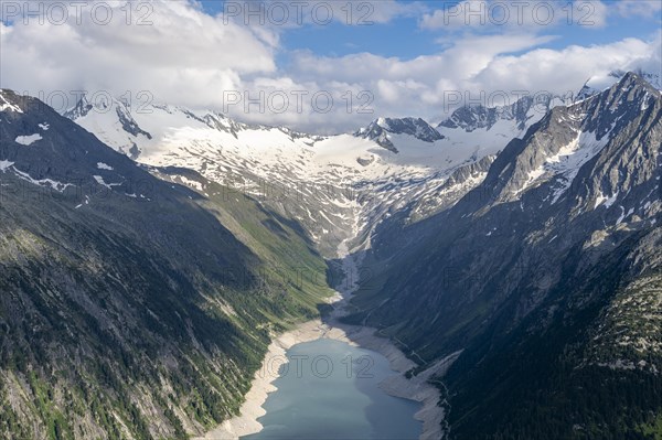 Picturesque mountain landscape near the Olpererhuette, view of turquoise-blue Schlegeisspeicher