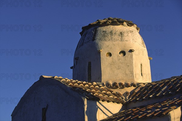 Scan, Old church tower in warm evening light with classic Mediterranean design, Aradena Gorge,