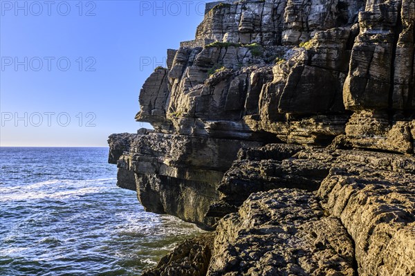Beautiful cliffs and rock formations in Peniche, Portugal, on sunny day. Weathered rock formations,