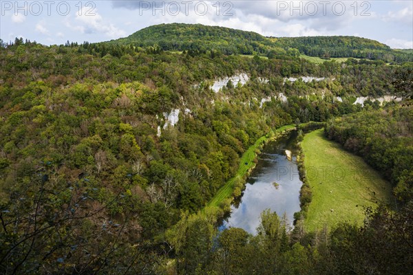 River with gorge and autumnal coloured forest, valley of the Loue, Lizine, near Besancon,