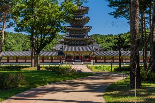 Buyeo, South Korea, July 7, 2018: Sidewalk leading to main gate of Neungsa Baekje Temple with five