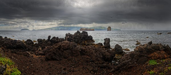 Panoramic view of the sea with the island of Faial and dramatic dark clouds, Madalena, Pico,