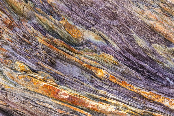 Coloured, ferrous mineral rocks on the beach of Topinetti, near Rio Marina, Elba, Tuscan