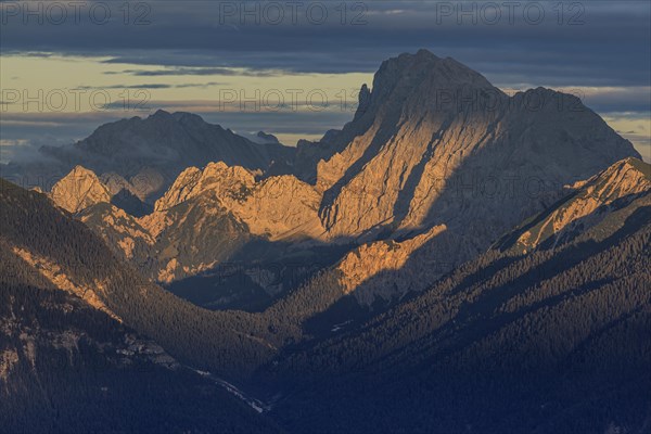 View over a valley to rugged mountains in the evening light, clouds, view from the Wank to the