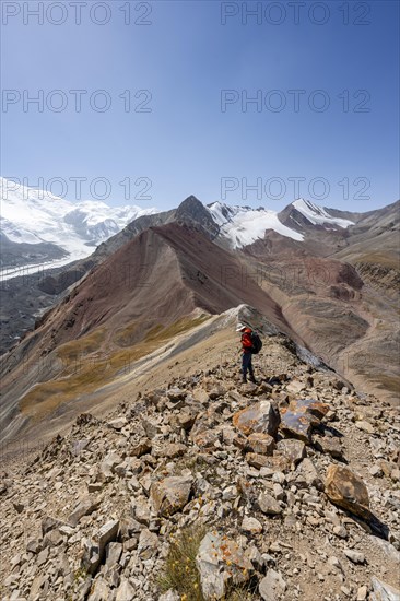 Mountaineer at Traveller's Pass with view of impressive mountain landscape, high mountain landscape