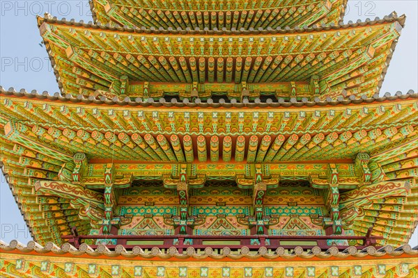 Buyeo, South Korea, July 7, 2018: Eves of colorful Buddhist five story pagoda at Neungsa Baekje