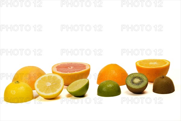 Fresh fruit cut in half. citrus fruits, lime, lemon, orange, grapefruit isolated on white