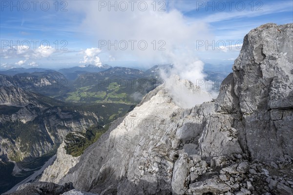 Rocky narrow mountain ridge with summit Watzmann Hochec, view from Watzmann middle summit to