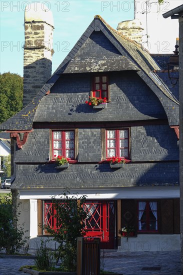 Rue du General de Gaulle in the old town centre of Le Faou with slate-roofed granite houses from