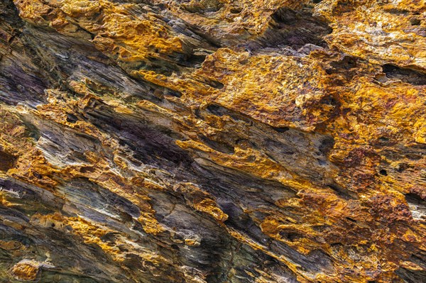 Coloured, ferrous mineral rocks on the beach of Topinetti, near Rio Marina, Elba, Tuscan