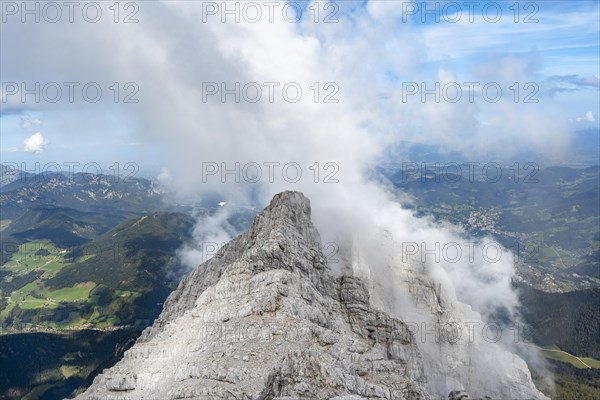 Rocky narrow mountain ridge with summit Watzmann Hocheck, view from Watzmann middle summit to