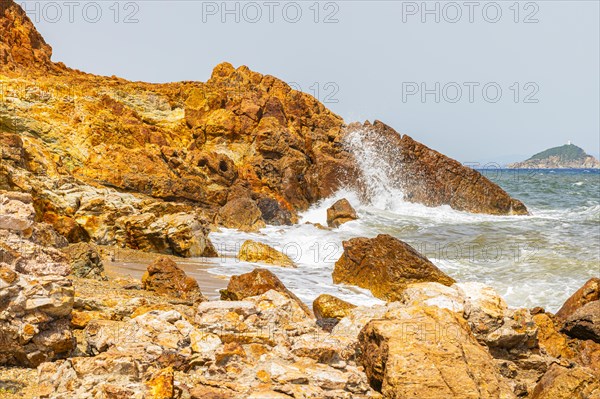 Mineral rocks washed by the sea on the beach of Topinetti, near Rio Marina, Elba, Tuscan