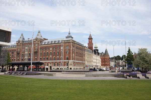 Angfaerjepark on the quay promenades, behind a traditional house and the town hall, Helsingborg,