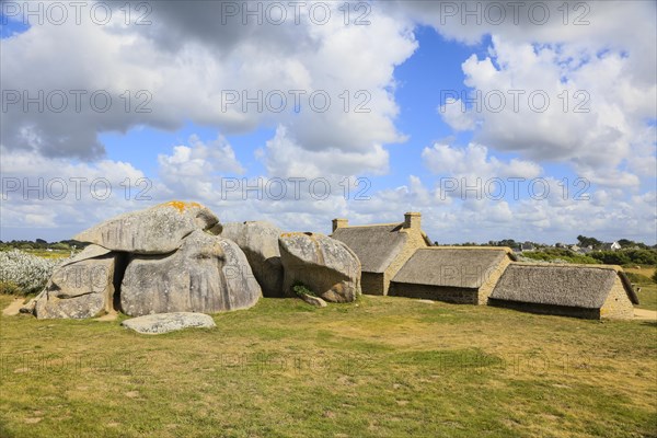 Former village of Meneham on the Atlantic coast with partly thatched houses between granite rocks,