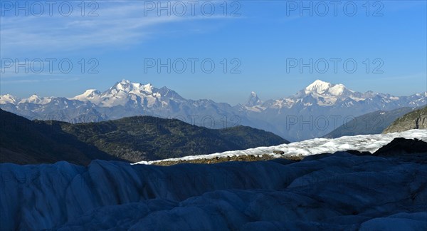 View from the Great Aletsch Glacier to the mountain chain of the Valais Alps with the peaks