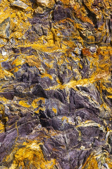 Coloured, ferrous mineral rocks on the beach of Topinetti, near Rio Marina, Elba, Tuscan
